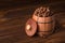 Roasted coffee beans in a wooden barrel