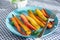 Roasted colorful carrots on plate