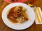 Roasted confit du canard with sauerkraut, potato dumplings and onion