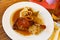 Roasted confit du canard with sauerkraut, potato dumplings and onion