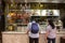 Roasted duck, Chicken, pork display with unidentified couple choosing a meal