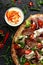 Roasted Duck kebab on flat bread with yogurt dip and salad