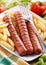 Roasted frankfurters with French fries