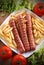 Roasted frankfurters with French fries