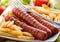 Roasted frankfurters with French fries