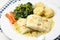 Roasted fresh cod fillet with cabbage and potatoes