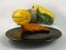 Roasted honey pumpkin on a black plate with an assortment of squashes