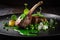 Roasted lamb chop with green peas and sauce on a black plate. Generative AI