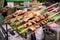 Roasted meat sold at street market near Kwang Si Falls, Laos.