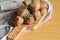 Roasted meatballs , delicious meat cutlets on wooden cutting board
