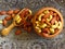 Roasted Natural Almond Nuts Badam and Cashew in a bowl made of wood and an wooden spoon on Oriental elements background.
