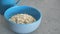 roasted oats flakes in a blue color bowl on table