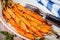 Roasted organic carrots with thyme closeup