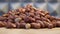 Roasted peanuts on a rotating surface close-up, detailed video