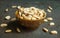 Roasted peeled salted peanuts in rustic bowl on wooden background