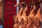 Roasted Peking ducks hanging in front of Chinese restaurant