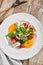 Roasted pepper salad with calamari and fresh greens