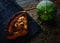 Roasted pumpkin on vintage tray in wooden table