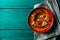 Roasted red bell pepper spread - muhammara - in a red bowl