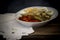 Roasted red peppers, sweet onions, aubergines and boiled eggs on wooden background