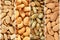 Roasted and salted nuts and seeds collage  - peanuts, pumpkin seeds, cashew nuts, almonds