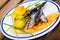 Roasted sardines with focaccia and potato croquettes