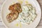 Roasted tenderloin of pork with mayonnaise potato salad on the p