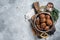 Roasted Vegan Lentil Meatballs in a skillet. Gray background. Top view. Copy space