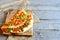 Roasted vegetable stuffed omelette on old wooden background with copy space for text