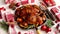 Roasted whole chicken or turkey served in iron pan with Christmas decoration