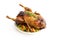 Roasted whole duck with vegetables, a festive Christmas meal isolated with small shadow on a white background, copy space