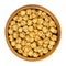 Roasted yellow chickpeas in wooden bowl