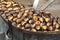 Roasting chestnuts on the grill by a street vendor in Rome,