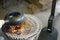 Roasting green tea with an earthenware baking pan on Earthen charcoal brazier. Roasted green tea is