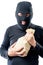 Robber in a mask with a bag of money on a white