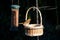 Robin, erithacus rubecula, on a wicker basket on a bird feeder