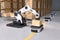 The Robot arm picks up the box to Autonomous Robot transportation in warehouses, Warehouse automation concept