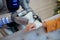 Robot carefully attaching bandage on girls wrist