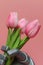 The robot gives flowers. The robots hand holds three tulips