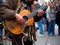 Robot guitarist playing for busy crowd