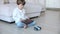 Robot made of bricks is controlled by a kid programmer, who uses tablet pc