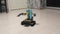 A robot made from a designer, drives on the floor in the apartment.