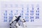 Robot Marking Date On Calendar