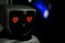 Robot with red eyes heart shape. Future, love and robotic concept. Love robot