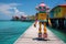 The robot is resting at a resort in a tropical paradise. The robot is sunbathing on a sunny beach near the sea. Animation