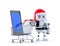 Robot Santa with tablet computer and shopping cart