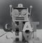 Robot talking head in monochrome with the word CHAT on a wooden