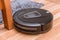 Robot vacuum cleaner on laminate wood floor