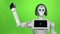 Robot waving hello. Green screen. Slow motion