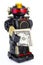 Robot on white background. Classic robot retro toy. Cute robot. Classical black plastic alloy robot with money